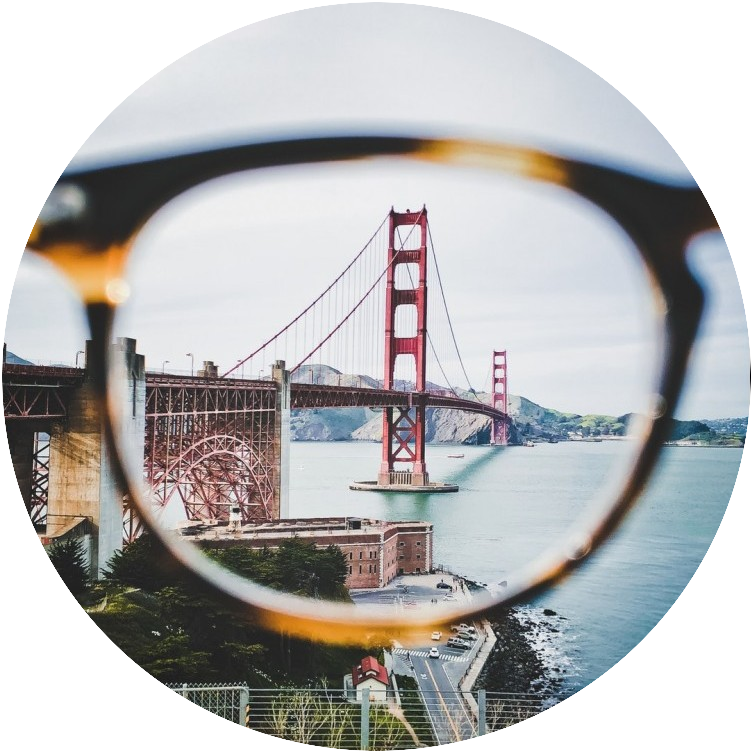 Photo of Golden Gate bridge looked at through a pair of glasses.