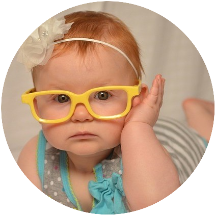 Baby with yellow glasses